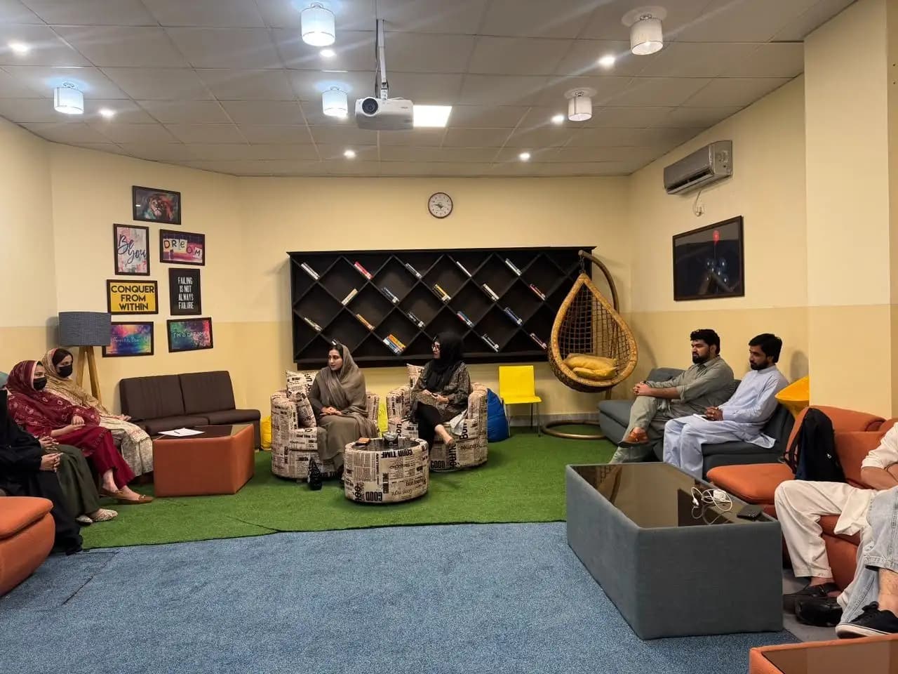 A SAYR youth dialogue session with students seated around the speakers